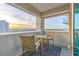 Balcony with a table and chairs and a beautiful view of the city at 2700 Las Vegas Blvd # 1301, Las Vegas, NV 89109