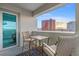 Balcony seating offers city views, with an outdoor table and chairs for relaxing and enjoying the skyline at 2700 Las Vegas Blvd # 1301, Las Vegas, NV 89109