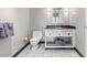 Modern bathroom with a toilet, a vanity and large grey floor tiles at 2700 Las Vegas Blvd # 1301, Las Vegas, NV 89109