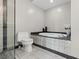 Luxurious bathroom with a marble tub, a toilet, and glass shower at 2700 Las Vegas Blvd # 1301, Las Vegas, NV 89109