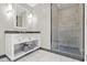Modern bathroom features a glass-enclosed shower, vanity with storage, and elegant fixtures at 2700 Las Vegas Blvd # 1301, Las Vegas, NV 89109