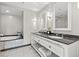 Elegant bathroom featuring marble floors, granite countertops, and a soaking tub at 2700 Las Vegas Blvd # 1301, Las Vegas, NV 89109