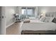 Cozy bedroom featuring two beds, hardwood floors, and access to a balcony at 2700 Las Vegas Blvd # 1301, Las Vegas, NV 89109