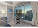 Bedroom area features a desk and chair, city views, and ample natural light at 2700 Las Vegas Blvd # 1301, Las Vegas, NV 89109