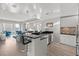 Modern kitchen with sleek countertops, stainless steel appliances, and ample bar seating overlooking the living area at 2700 Las Vegas Blvd # 1301, Las Vegas, NV 89109