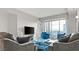 Comfortable living room with city views, a blue rug, modern furniture, and large windows at 2700 Las Vegas Blvd # 1301, Las Vegas, NV 89109