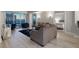 Open-concept living room with city views, sofa and chairs, and a glimpse of the bedroom at 2700 Las Vegas Blvd # 1301, Las Vegas, NV 89109