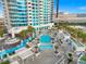Luxurious pool deck with multiple pools, stylish lounge chairs, and lush palm trees, perfect for relaxation and entertainment at 2700 Las Vegas Blvd # 1301, Las Vegas, NV 89109