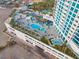 Luxurious rooftop pool area with modern design, complete with palm trees and stylish lounging spaces at 2700 Las Vegas Blvd # 1301, Las Vegas, NV 89109