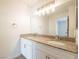 Bright bathroom featuring a double sink vanity with granite countertop and modern lighting at 2801 N Rainbow Blvd # 238, Las Vegas, NV 89108