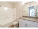 Well-lit bathroom featuring tub-shower, toilet, vanity, and sink with granite countertop at 2801 N Rainbow Blvd # 238, Las Vegas, NV 89108