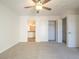 Bedroom featuring a ceiling fan, carpet, and closet and ensuite bathroom access at 2801 N Rainbow Blvd # 238, Las Vegas, NV 89108
