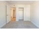 Spacious carpeted bedroom featuring a closet and a doorway leading to other rooms at 2801 N Rainbow Blvd # 238, Las Vegas, NV 89108
