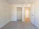 Carpeted bedroom has open closet and a doorway leading to other rooms at 2801 N Rainbow Blvd # 238, Las Vegas, NV 89108