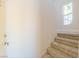 Bright entryway with carpeted stairs leading to the upper level and a large window at 2801 N Rainbow Blvd # 238, Las Vegas, NV 89108