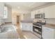 Well-lit kitchen featuring modern appliances, granite counters, and convenient layout at 2801 N Rainbow Blvd # 238, Las Vegas, NV 89108