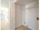 Interior laundry room featuring a shelf and nearby kitchen at 2801 N Rainbow Blvd # 238, Las Vegas, NV 89108