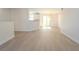 Open-concept living space with modern floors leading to the kitchen and patio at 2801 N Rainbow Blvd # 238, Las Vegas, NV 89108