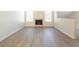 Inviting living room featuring a classic fireplace, large windows, and modern flooring at 2801 N Rainbow Blvd # 238, Las Vegas, NV 89108