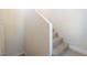 Simple carpeted staircase ascends along a white wall with white trim details at 2801 N Rainbow Blvd # 238, Las Vegas, NV 89108