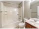 Clean bathroom features a shower-tub combo and vanity with storage at 3725 Moonshine Falls Ave, North Las Vegas, NV 89085