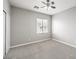 Bedroom with neutral walls and carpeted floors boasts a large window and closet with sliding doors at 3725 Moonshine Falls Ave, North Las Vegas, NV 89085