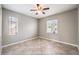 Neutral bedroom with many windows allowing plenty of natural light, and tile flooring at 3725 Moonshine Falls Ave, North Las Vegas, NV 89085