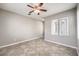 Neutral bedroom with many windows allowing plenty of natural light, and tile flooring at 3725 Moonshine Falls Ave, North Las Vegas, NV 89085