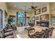 Spacious clubhouse lounge with high ceilings, comfortable seating, fireplace, and large windows at 3725 Moonshine Falls Ave, North Las Vegas, NV 89085