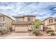 Inviting two-story home with a well-manicured yard and a two-car garage at 3725 Moonshine Falls Ave, North Las Vegas, NV 89085