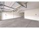 Spacious garage with concrete floor and overhead lighting at 3725 Moonshine Falls Ave, North Las Vegas, NV 89085