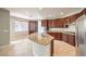 Gourmet kitchen features stainless steel appliances, island and granite countertops at 3725 Moonshine Falls Ave, North Las Vegas, NV 89085