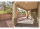 Covered patio in backyard with gravel ground cover, providing shade and outdoor living space at 3725 Moonshine Falls Ave, North Las Vegas, NV 89085