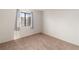 Bright, carpeted bedroom with a large window offering outdoor views at 3740 Desert Marina Dr # 7, Laughlin, NV 89029