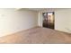 Neutral bedroom with carpet, white walls, and a sliding glass door that leads to an outdoor balcony at 3740 Desert Marina Dr # 7, Laughlin, NV 89029