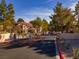 Image of the gated entrance to the Laughlin Bay Village complex, with mature landscaping and trees at 3740 Desert Marina Dr # 7, Laughlin, NV 89029