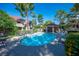 Image of the community pool at Laughlin Bay Village, featuring lounge seating and mature trees at 3740 Desert Marina Dr # 7, Laughlin, NV 89029