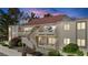 View of building exterior featuring multi-level patios, red brick accents, desert landscaping, and secure access at 3740 Desert Marina Dr # 7, Laughlin, NV 89029