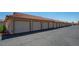 Exterior of a long row of garages with white doors and a red tiled roof for community parking at 3740 Desert Marina Dr # 7, Laughlin, NV 89029
