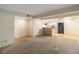 View into the living room of a kitchen with wood floors, a breakfast bar, and neutral paint at 3740 Desert Marina Dr # 7, Laughlin, NV 89029