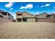 Large backyard with gravel and artificial grass featuring a rear home view with a covered patio at 3909 Grazing Gazelle Ave, North Las Vegas, NV 89084
