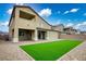 Spacious backyard featuring lush artificial turf, perfect for outdoor entertaining and relaxation at 3909 Grazing Gazelle Ave, North Las Vegas, NV 89084