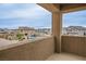 Balcony view showcasing a community pool and neighborhood scenery on a sunny day at 3909 Grazing Gazelle Ave, North Las Vegas, NV 89084