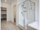 Well-lit bathroom with a glass-enclosed shower and an adjacent toilet room at 3909 Grazing Gazelle Ave, North Las Vegas, NV 89084