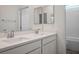 Modern bathroom featuring double sinks, a wide mirror, and a tub-shower combo at 3909 Grazing Gazelle Ave, North Las Vegas, NV 89084