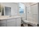 Modern bathroom with white vanity, shower, toilet and ample natural light at 3909 Grazing Gazelle Ave, North Las Vegas, NV 89084