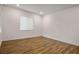Minimalist bedroom featuring modern recessed lighting and elegant laminate flooring for a clean aesthetic at 3909 Grazing Gazelle Ave, North Las Vegas, NV 89084