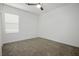 Well-lit bedroom with neutral carpeting and a ceiling fan at 3909 Grazing Gazelle Ave, North Las Vegas, NV 89084