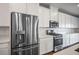 Stylish kitchen featuring stainless steel appliances, white cabinets, and a gas range, creating a modern and functional cooking space at 3909 Grazing Gazelle Ave, North Las Vegas, NV 89084