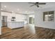 Modern kitchen with stainless steel appliances, a large white island, and seamless access to the backyard at 3909 Grazing Gazelle Ave, North Las Vegas, NV 89084